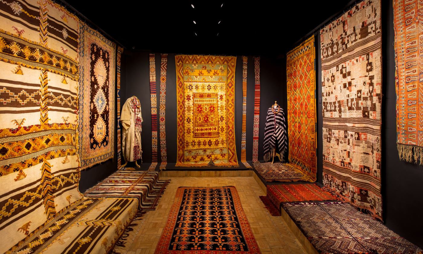 Museum room hung with Moroccan carpets